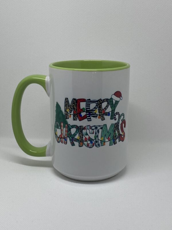 A green and white mug with the words merry christmas written in it.