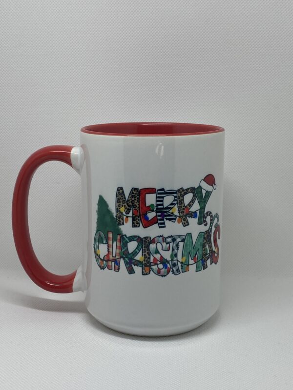 A red and white coffee mug with the words " merry christmas ".