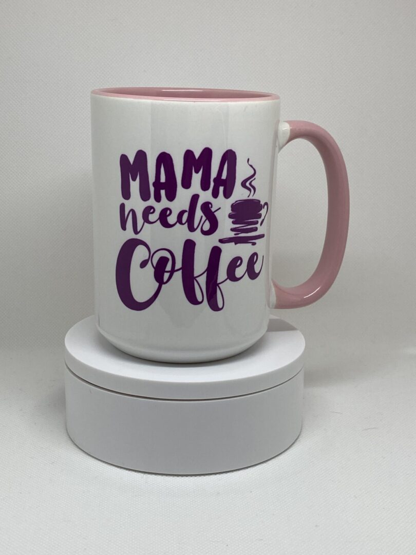 A coffee mug that says mama needs coffee.