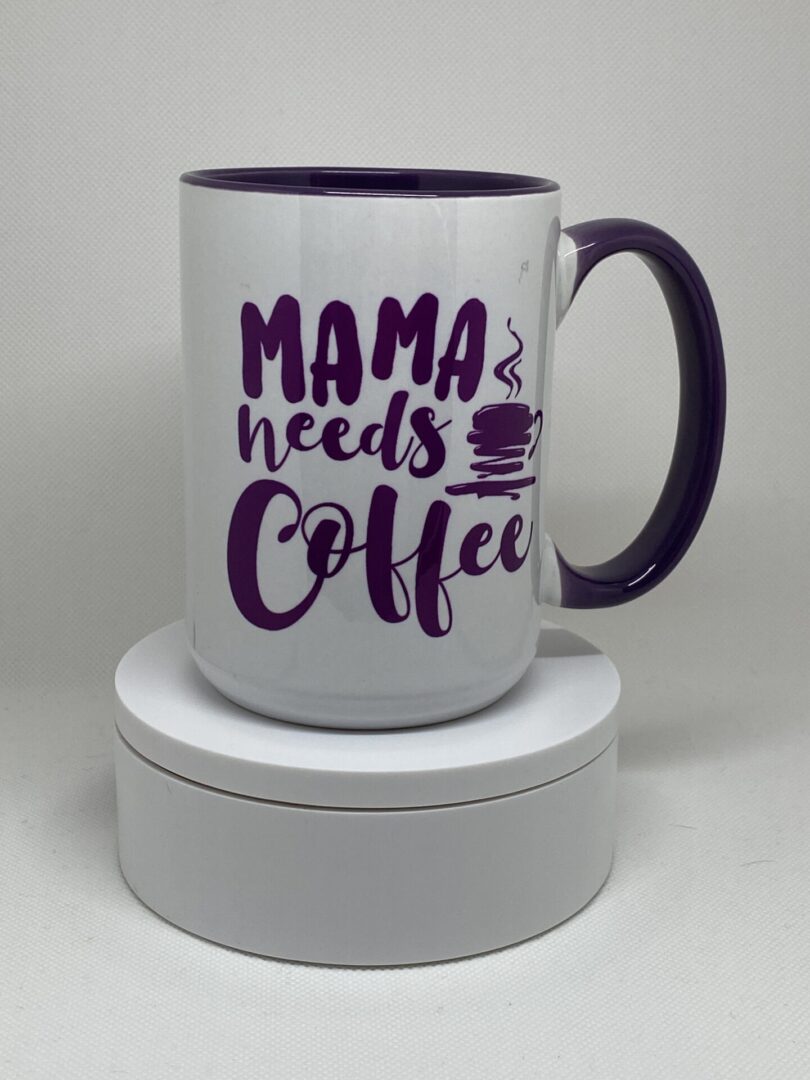 A coffee mug that says mama needs coffee.