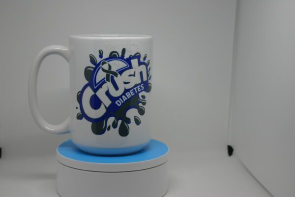 A coffee mug sitting on top of a blue coaster.